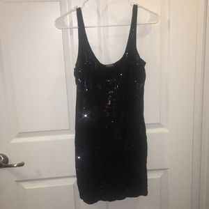 Express lightweight black dress with gems.